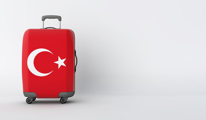 Travel suitcase with the flag of Turkey. Holiday destination. 3D Render