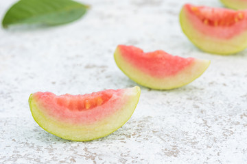Pink guava on white background