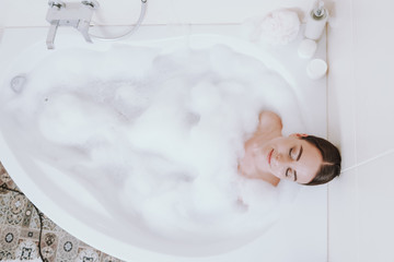 Top view of a delighted nice woman enjoying bath