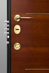 Red Wood Door With Gold Key Lock And Handle