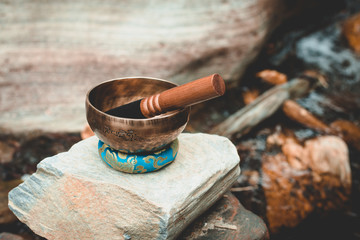 singing bowl in a river