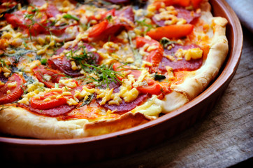 Delicious italian pizzas served on wooden table