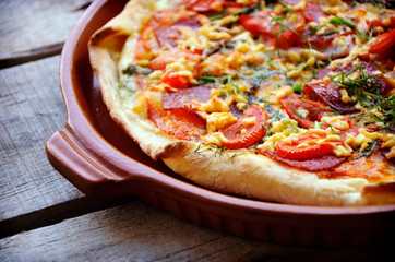 Delicious italian pizzas served on wooden table
