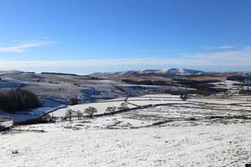 Farmland covered with snow in the beautiful Forest of Bowland area of outstanding natural beauty in...