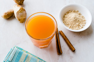 Jamu Healthy Asian Drink with Turmeric and Cinnamon Stick, Orange Juice