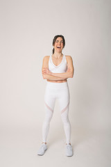 Girl with a sports outfit and white background