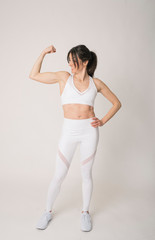 Girl with a sports outfit and white background