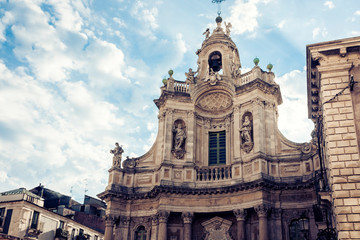 Fototapeta na wymiar Beautiful cityscape of Italy, facade of old cathedral in Catania, Sicily, famouse baroque church.