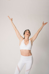 Girl with a sports outfit and white background