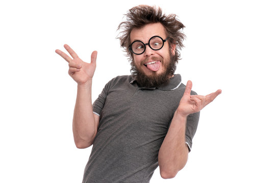 Crazy bearded Man with funny Haircut in eye Glasses making grimace - funny face. Casual Silly guy, isolated on white background. Emotions, and signs concept.