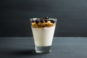 Healthy and tasty breakfast with muesli black currant and yogurt. Selective focus.