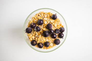 Healthy and tasty breakfast with muesli black currant and yogurt. Selective focus.