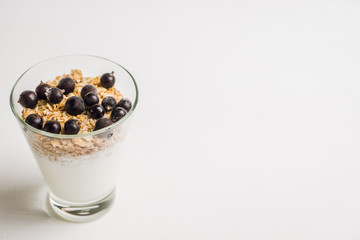 Healthy and tasty breakfast with muesli black currant and yogurt. Selective focus.