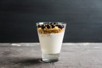 Healthy and tasty breakfast with muesli black currant and yogurt. Selective focus.
