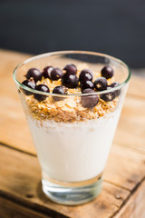 Healthy and tasty breakfast with muesli black currant and yogurt. Selective focus.