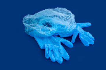 Sterile aseptic surgical glove blue background cap hat top view still life
