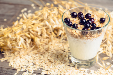 Healthy and tasty breakfast with muesli black currant and yogurt. Selective focus.