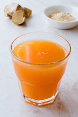 Jamu Healthy Asian Drink with Turmeric and Cinnamon Stick, Orange Juice
