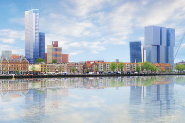 Waterfront panorama of Erasmus bridge across new meuse, theatre, headquaters, port center of Rotterdam