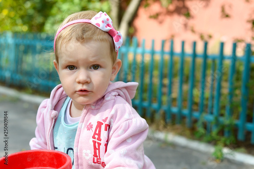 Portrait Of Beautiful Little Baby Girl Looking Straight