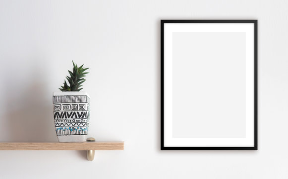 Blank framed poster on the wall, mock up 
