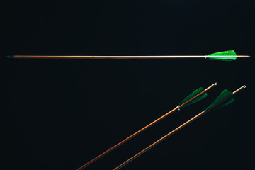 Three wood arrow one flying . Beautiful  smog background. Medieval weapons are handmade.