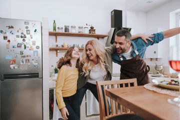 Happy family enjoying being together and having fun at home