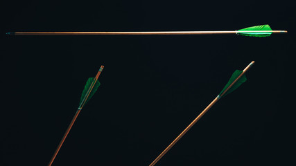 Three wood arrow one flying . Beautiful  smog background. Medieval weapons are handmade.