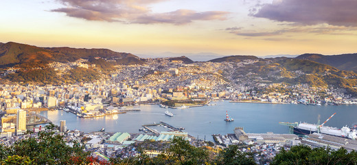 Business concept, modern cityscape of nagasaki dusk from mount inasa, the new top 3 nightview of the world, aerial view, copy space