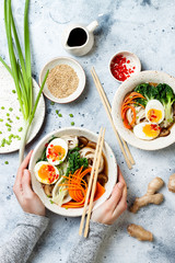 Ramen traditional japanese noodle soup with eggs, pak choi cabbage, meat broth, carrot, mushrooms...