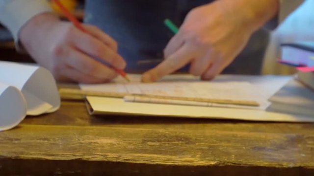 man works at a desk with documents.blurred video.screen saver on business topics.