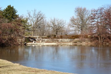 The lake in the park on a beautiful sunny winter day.