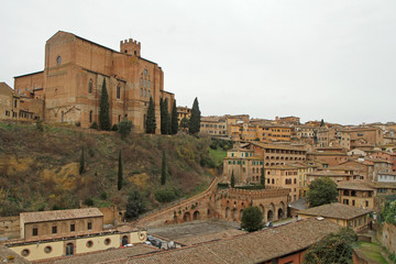 Fototapeta premium Basilica of San Domenico and cityscape of italian city Siena