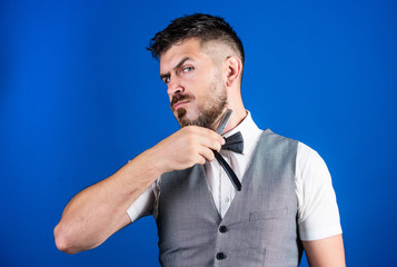 Giving a clean shave. Barber with vintage barber tool. Razor barber shop. Bearded man with straight...