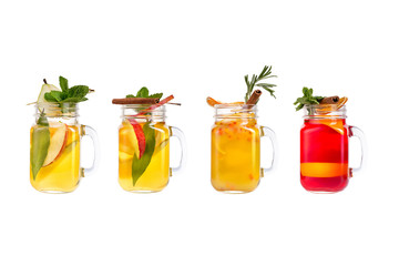 Set with different cocktails and lemonades on a white background.