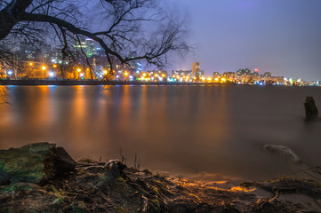 Night in Dnipro city over the river - long exposure photo.