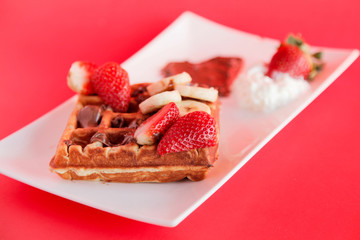 Strawberry and Banana flavour waffle with whipped cream