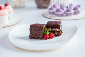 chocolate cake with strawberries on a white background