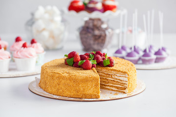 sponge cake with strawberries on white background