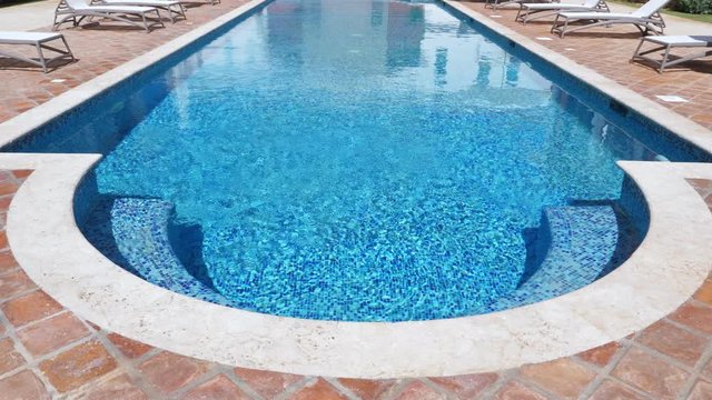 Swimming pool with sunbeds, nobody