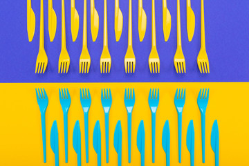 Colorful set of plastic table ware isolated on background
