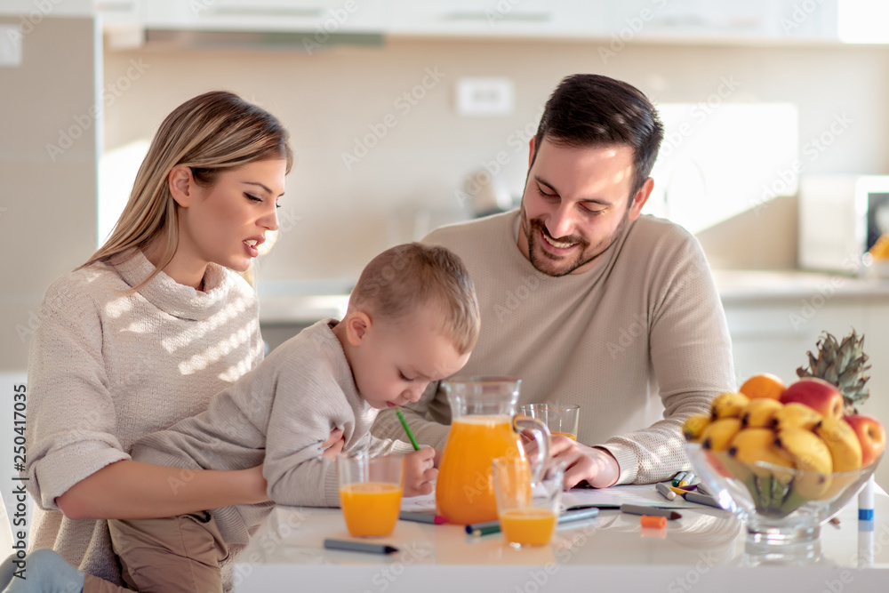 Sticker family with child having fresh fruit juice at home