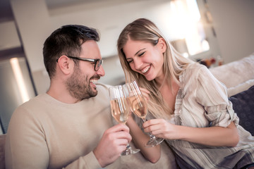 Couple drink wine at home