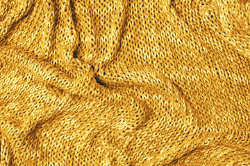Knitted texture background yellow top view flat
