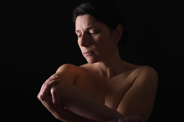middle-aged woman with shoulder pain