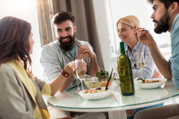 Friends having lunch together at home