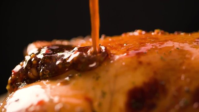 Pouring Fried Roasted Chicken with sauce Extremely closeup Macro shot Slow motion cooking video