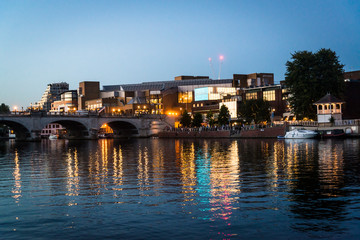Fototapeta premium Kingston Bridge and riverside at night, Kingston upon Thames, Surrey, England, UK
