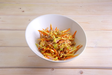 Salad with carrot, cabbage, paprika and walnut
