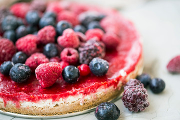 Raw cake with berries, vegan dessert with fresh berries closeup